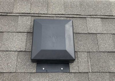 Storm-Proof-grey-roof-with-black-vent